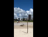 Collab IITW - Woman red dress tiktok dance at beach