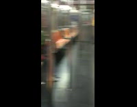 Subway passenger falls asleep on the subway with green scarf covering their head