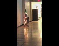 Guy wears string christmas lights