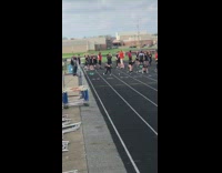 Girl records sister running on black track school