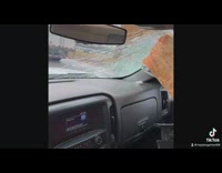 Dashcam captures wood flying through windshield
