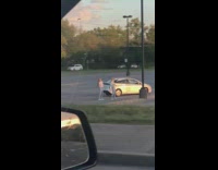 Two woman match outfits tiktok dance parking lot