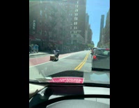 Guy Rolls Box Across Street 