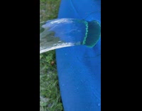 Water coming out of blue inflatable pool illusion still