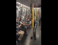 Man swinging on subway handrails and poles