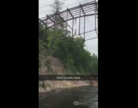 Girl jumps bridge lands on back river 