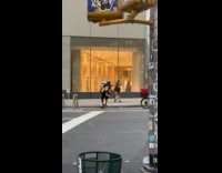 Man wearing strange costume while riding one wheel 