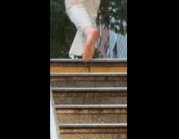 Woman climbing stairs barefoot 