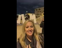 Guy poses with giant L letter