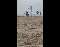 Girl sets tripod up wind knocks over