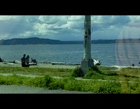 Woman in sports bra jog towards the videographer