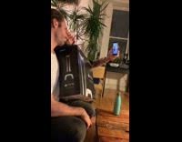 Two guys dance hold PS5 box bottle