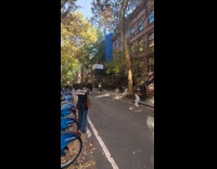 Woman skating with sign looking for a husband