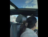 Car accident caught on camera as girl drives by 