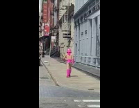 Pink storm trooper helmet shoes guy sidewalk 