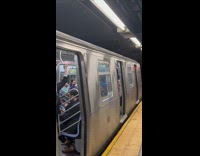 Collab WINY - Man bring large mattress in subway train