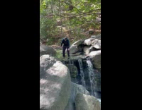 Man sings by the falls on Sunday