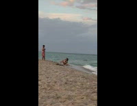 Woman bikini hiss and throw sand beach