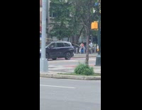 Guy holds stick ask money on street