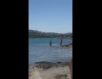 Woman bikini splash water beach photo shoot