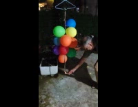 Guy lights rope on fire balloons pop 