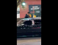 Police confiscate phone from handcuffed man street