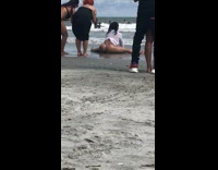 Woman in bikini splits and moves her butt cheeks