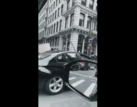 White lamp sticks out black car sunroof 