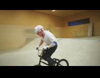 Kid does a 720 degree bike spin in skatepark