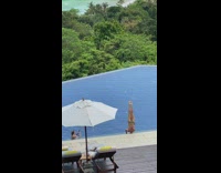 Woman bikini headstand  legs up straight pool