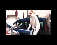 Guy attempts to jump onto railing skateboard 