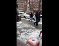 Man use baseball bat clear off car snow