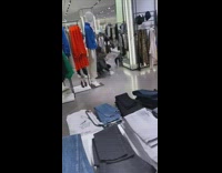 Girls take photo in clothing store 