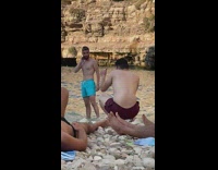 Man blue shorts placed hand on his nape