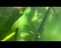 Person swim snorkel show bridge submerged underwater 