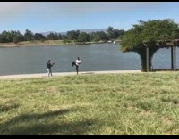 Guy white shirt one leg raise knee 