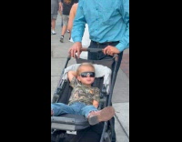 Toddler chilling on his stroller 