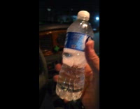 Guy hits water bottle on steering wheel freeze