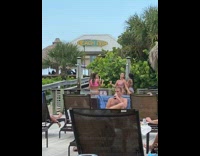 Girl bikini raise arms beach bar shower