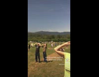 Group of people in parking looking at solar eclipse 