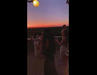 Two girls dance rooftop sunset white skirt 