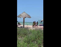 Three women in bikini tiktok dance at the beach