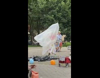 Girl inside trash bag guy hula pt. 2
