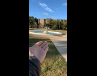 Blue bike upside down in middle of water fountain