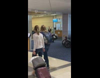 Girl black dress spin peace sign airport