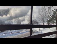 Snowmaker makes clouds of snow mountain 