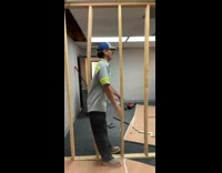 Guy moving between two wood beams 