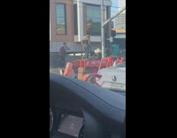 Man in a skateboard rides on top of the excavator