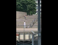 Woman grey leggings bend pose public stairs