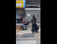 Woman pose like pooping dirty water from fire hydrant